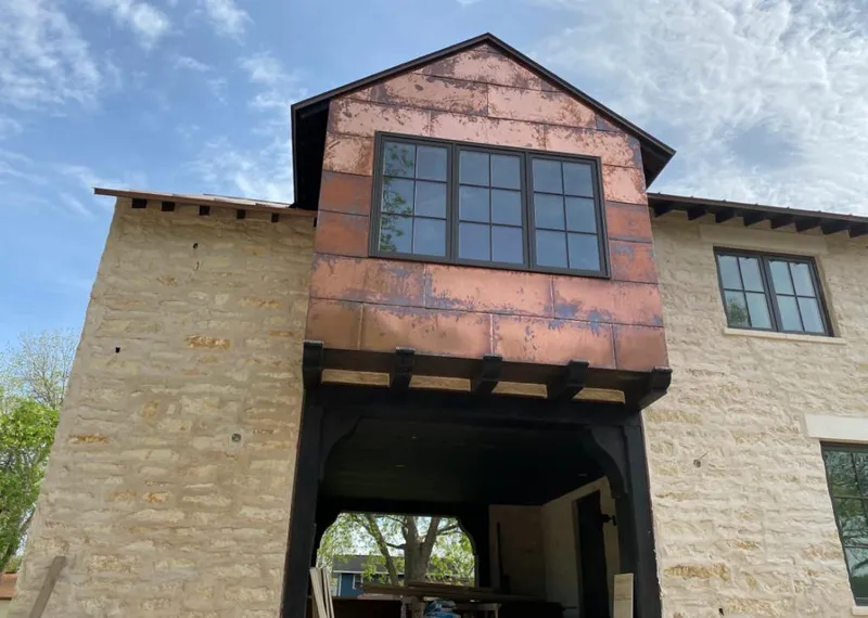 Copper metal panel facade on a stone building for Metal Roof Coating in Hidden Valley